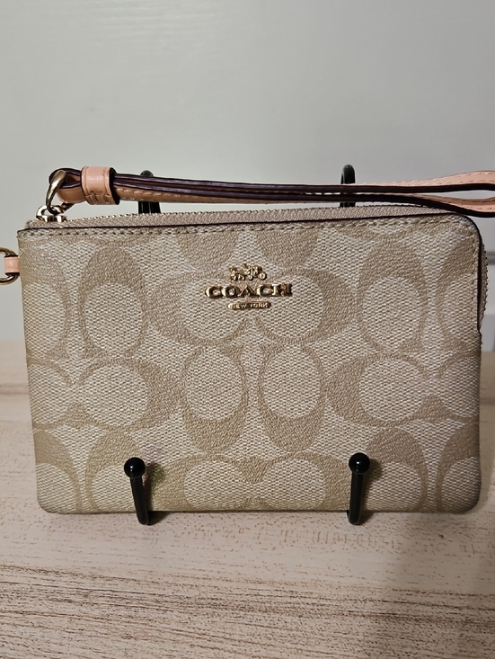 Coach Handbags - Coach EUC Khaki Canvas Wristlet with Light Peach Strap